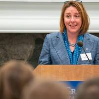 Woman speaker at podium